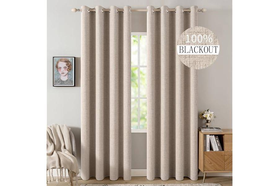 Natural beige linen blackout curtains on a bedroom window with soft daylight, an oak cabinet, books, flowers, and cozy neutral decor.
