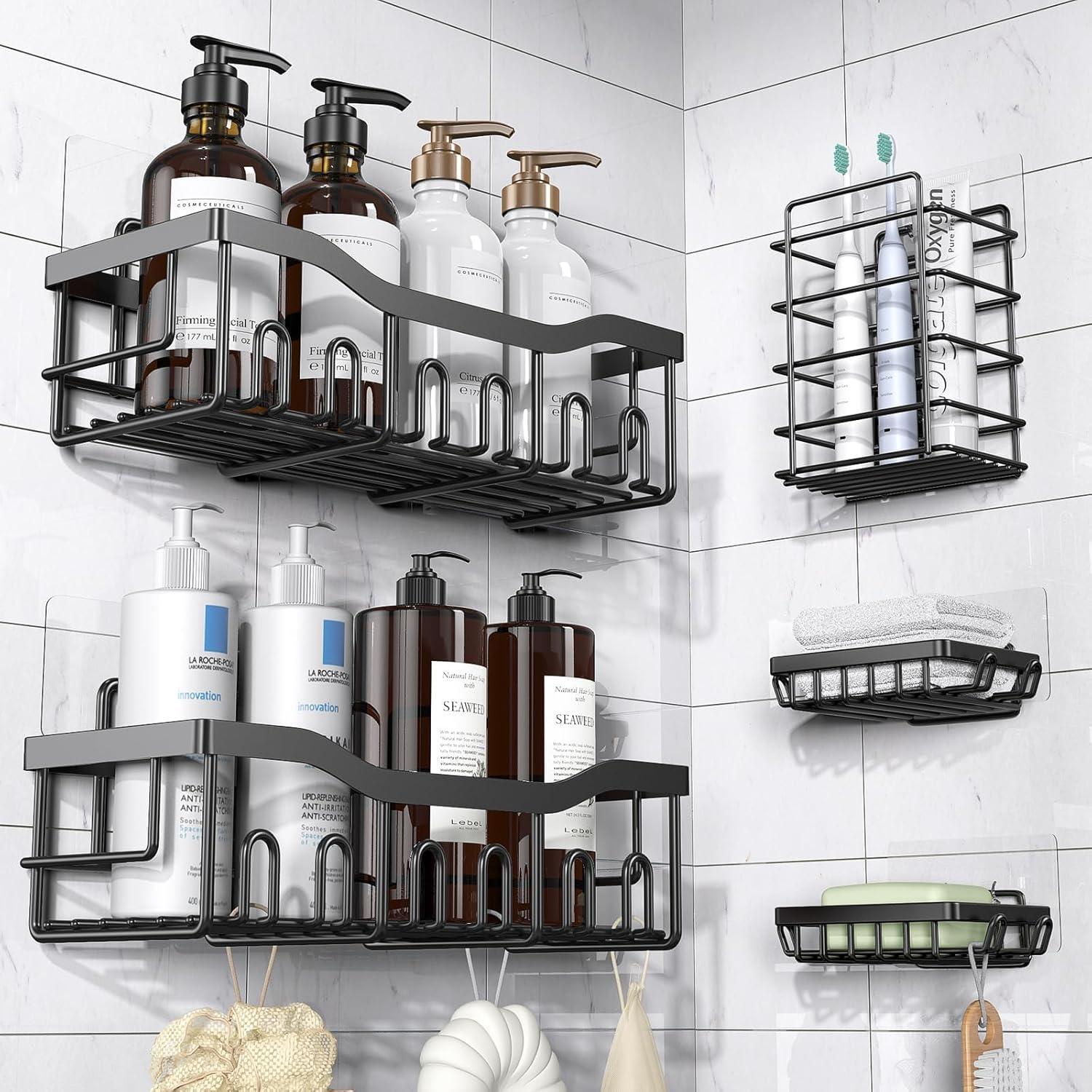 Black adhesive shower caddies on white marble tile holding toiletries for a clean modern setup and no drill bathroom organization ideas.